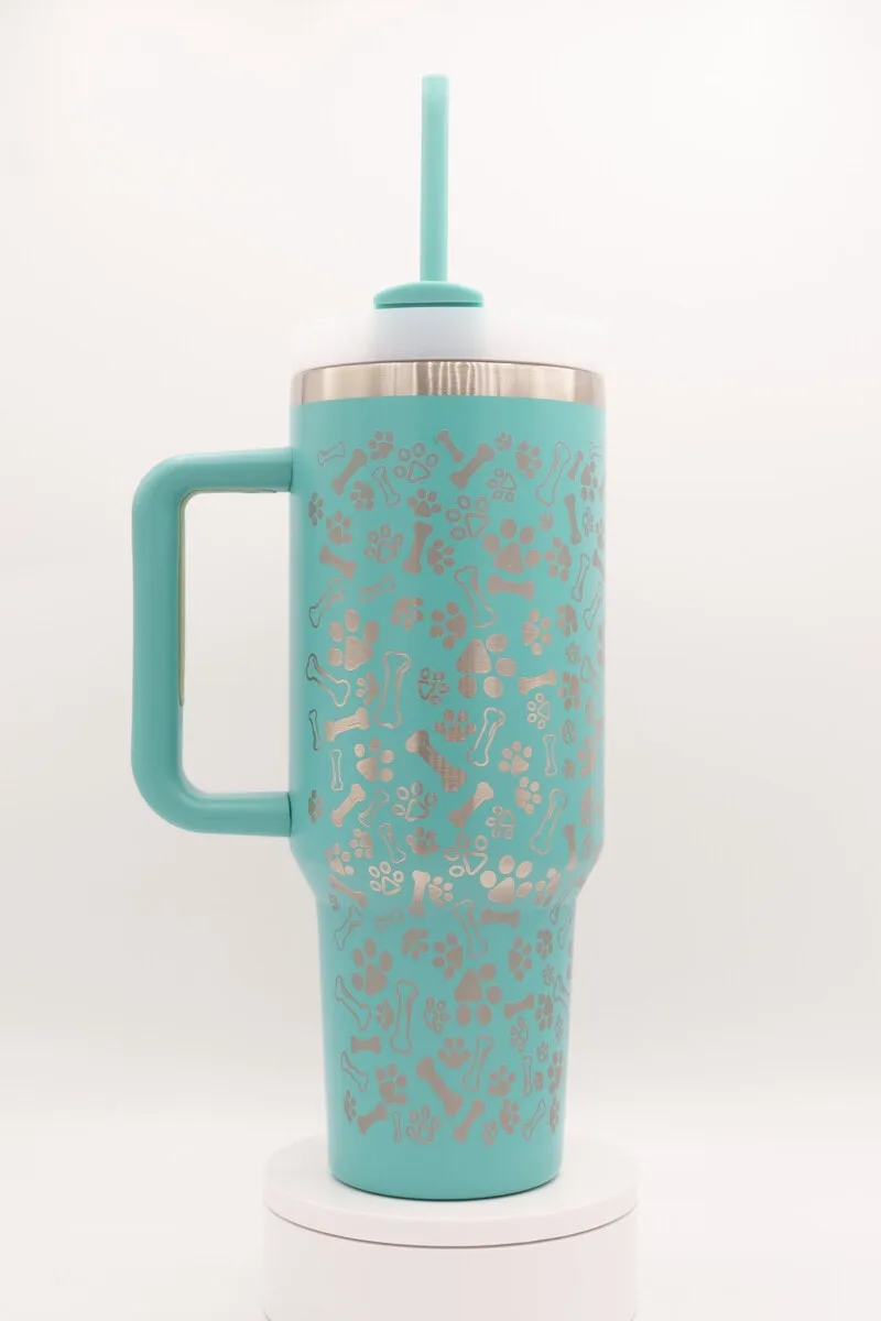 Travel mug with floral design and straw, perfect for on-the-go beverages.