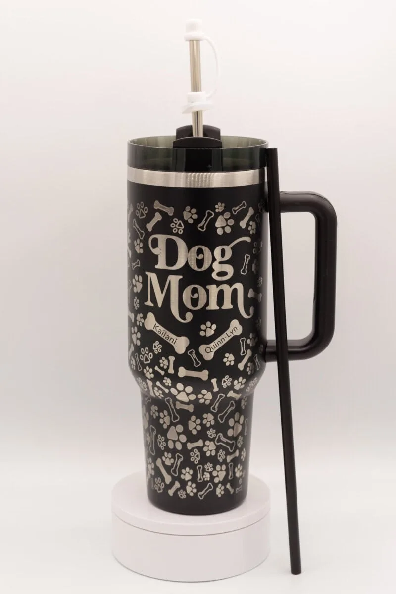 Custom dog mom 40oz stainless steel tumbler with engraved pet names and pictures.