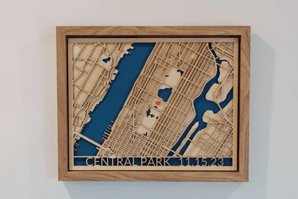 Laser cut map of Central Park with detailed street layout and water features.