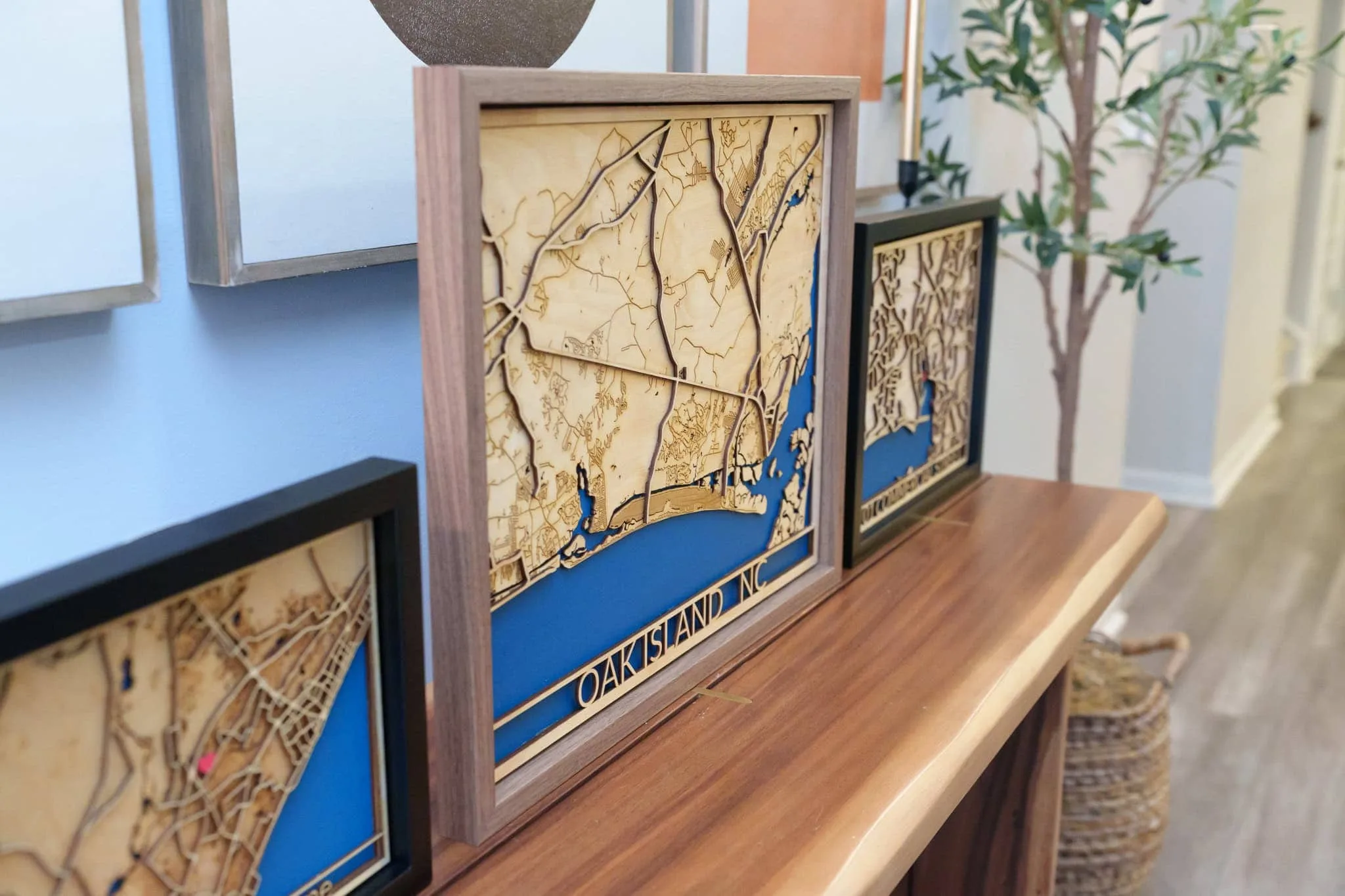 Laser cut map art of Oakland, CA with blue water details.