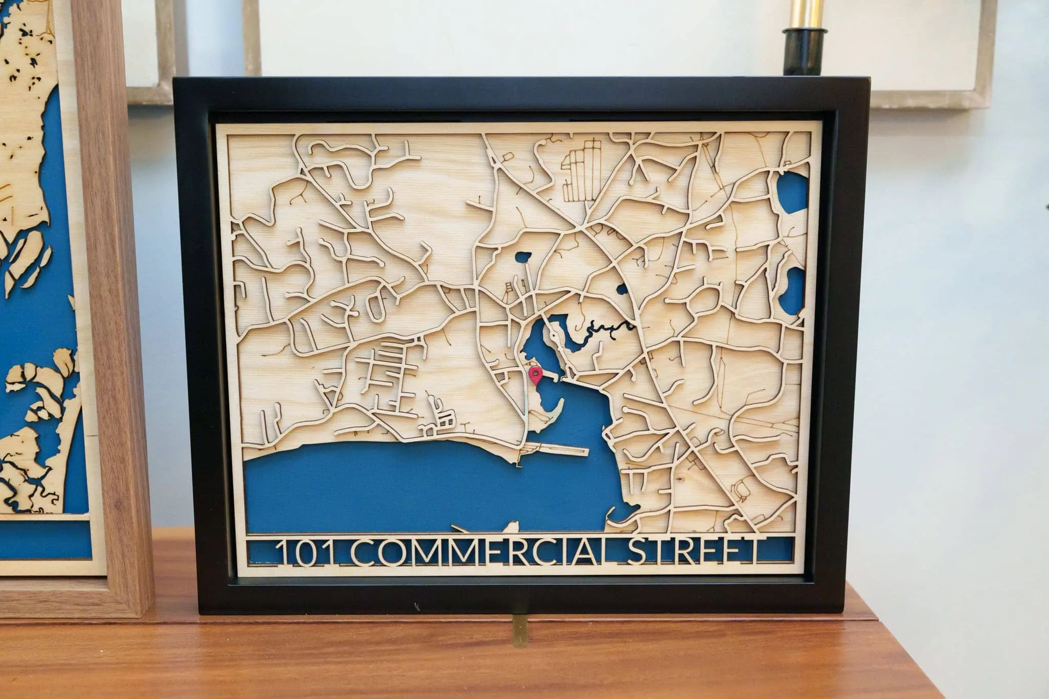 Laser cut map art of 101 Commercial Street with intricate street details.