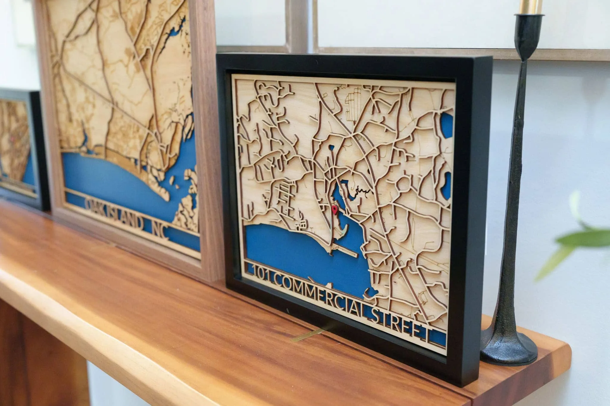 Laser cut map art of Long Island, NY in a black frame.