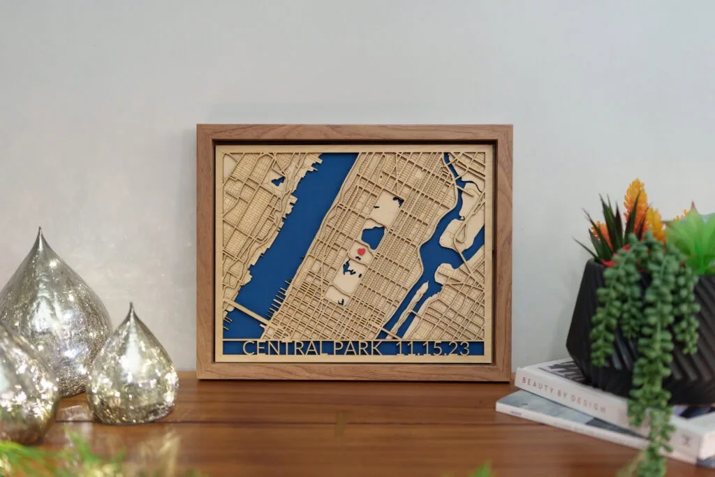 Laser cut map of Central Park with detailed street layout and water features.