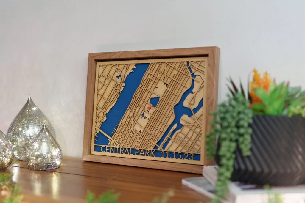 Laser cut map of Central Park with detailed street layout and water features.