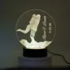 Personalized 3D LED night light with couple's names and date.