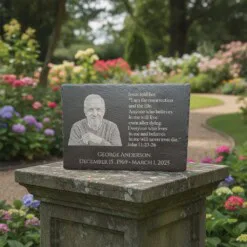 Personalized black slate memorial plaque engraved with portrait and quote.